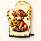 Close-up of one Sunflower Highland cow oven mitt showing the calf and sunflower print, black cuff and hanging loop on warm ivory.