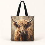 Front view of one vintage Highland cow tote bag with black handles and country artwork. Sold individually.