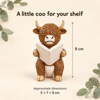 Reading Highland cow figurine dimensions, approximately 5 by 7 by 9 cm, with a 9 cm height arrow.