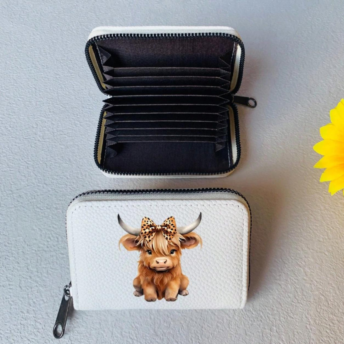 Highland cow card holder inside the open purse