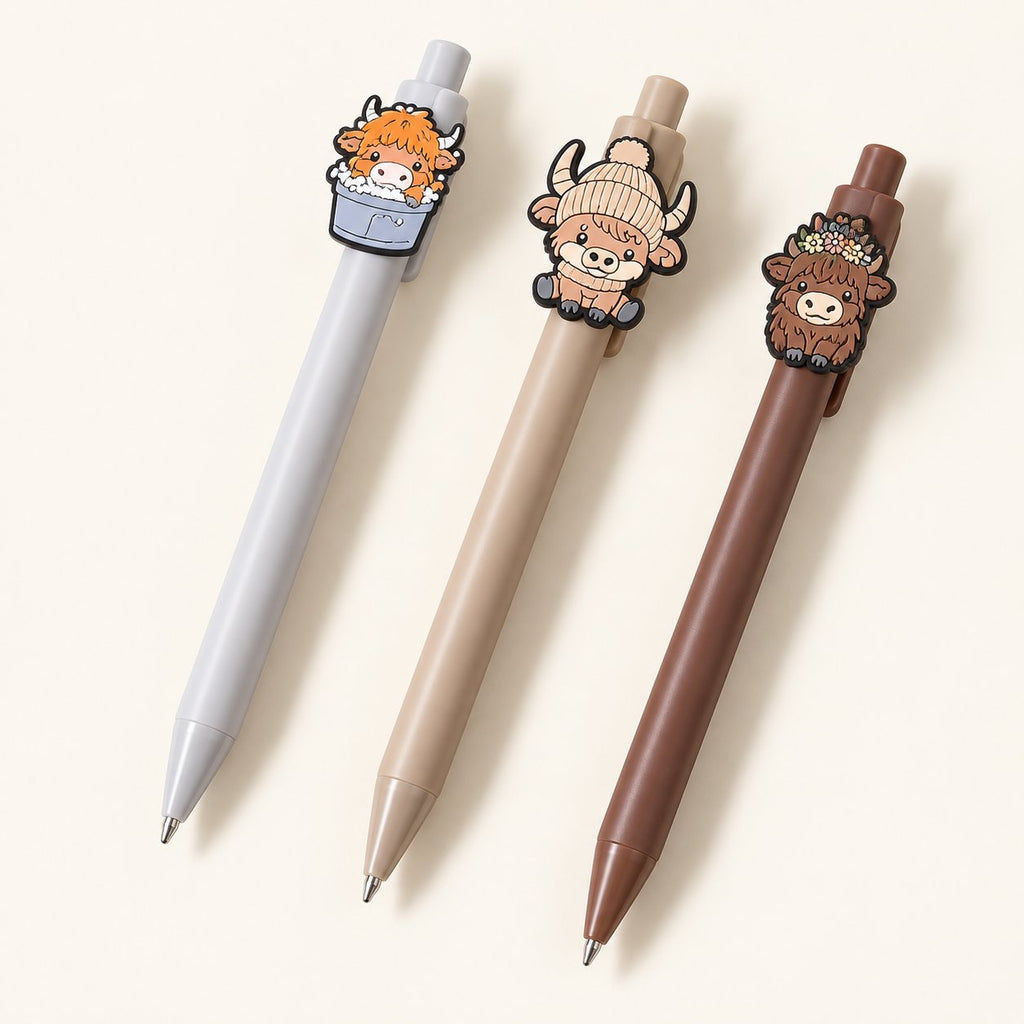 Examples of Highland cow retractable pens with grey, beige and brown barrels; sold individually as assorted designs