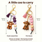 Pink and purple Highland cow beaded tassel keyrings, approximately 15 cm overall including clasp and cord ends. Choose one design; cord and connector lengths may vary.