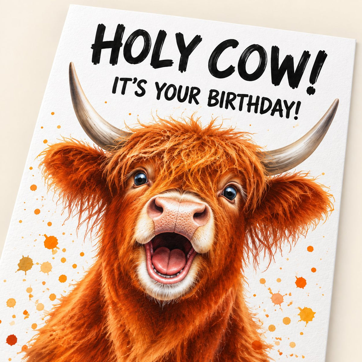 Close-up of the Holy Cow birthday card showing the printed calf artwork and birthday wording.