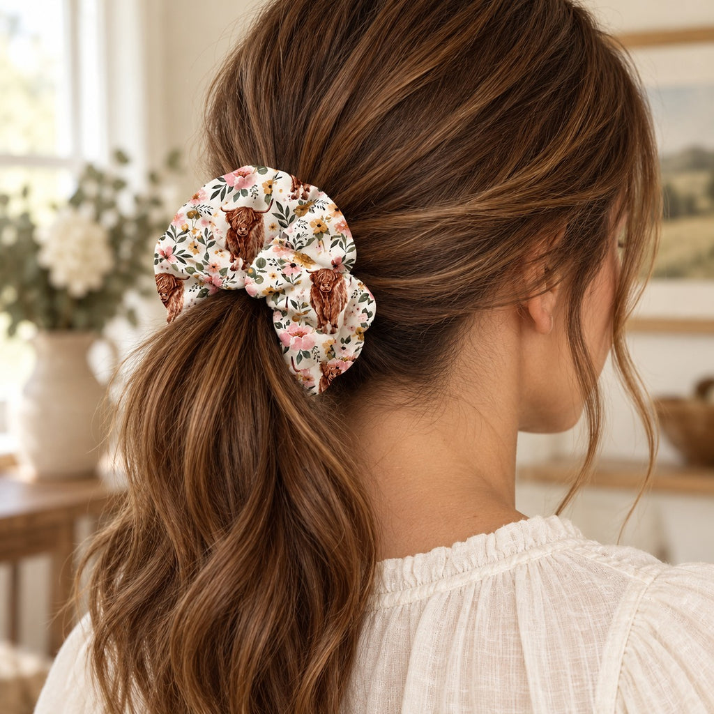 Floral Highland Cow Scrunchie. worn.