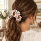 Floral Highland Cow Scrunchie. worn.