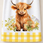 Close-up of the Meadow Calf tea towel artwork, white fabric and yellow gingham border