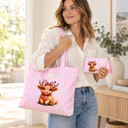 Styled image of a woman carrying the pink striped Highland cow tote on her shoulder and holding the matching small zipped purse.