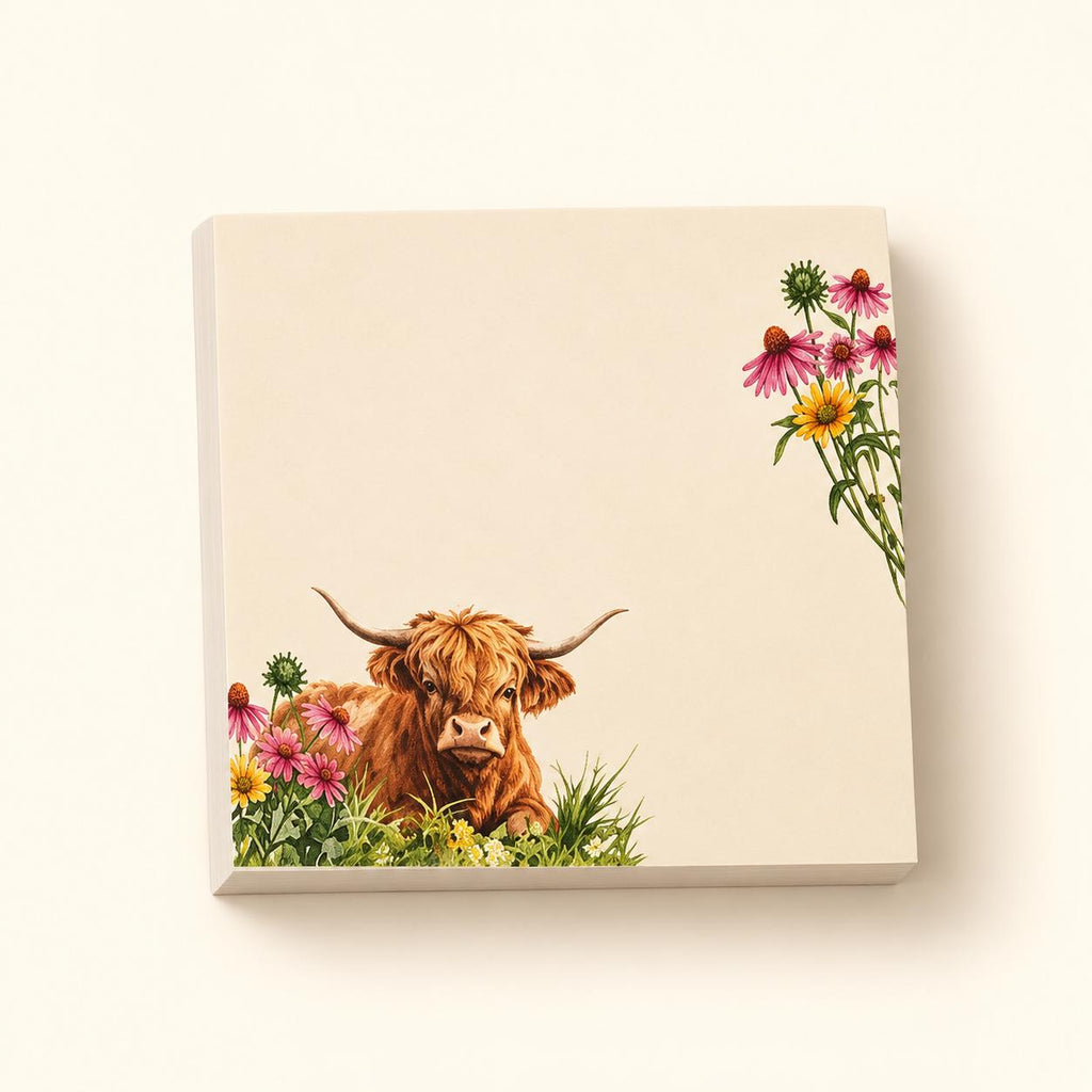 Wildflower Meadow Highland cow sticky-note pad with a resting cow and pink and yellow flowers on a cream background.