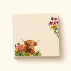 Wildflower Meadow Highland cow sticky-note pad with a resting cow and pink and yellow flowers on a cream background.