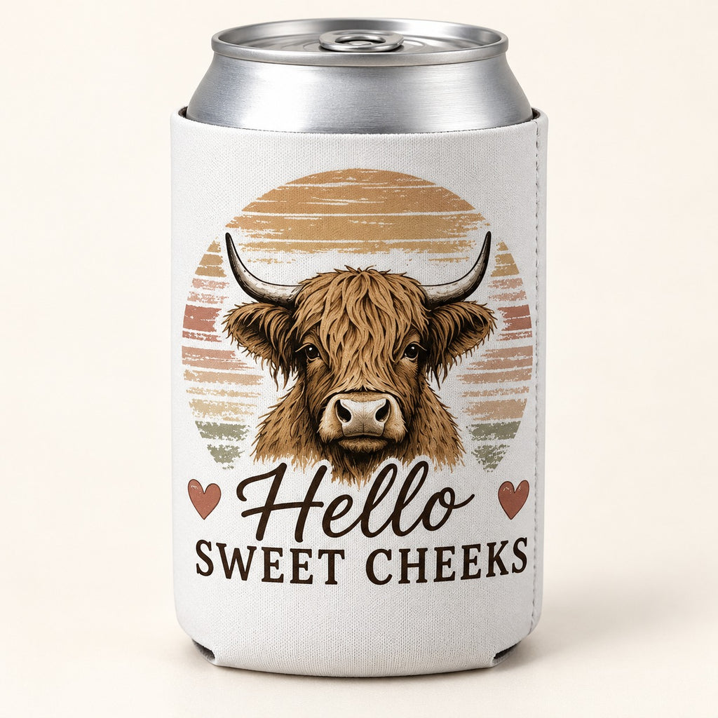 Sweet Cheeks Sunset Highland cow stubbie cooler shown around a silver can. One cooler; can not included.