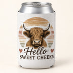 Sweet Cheeks Sunset Highland cow stubbie cooler shown around a silver can. One cooler; can not included.