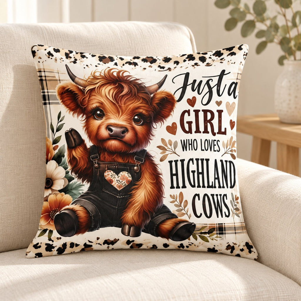 Just a Girl Highland cow cushion styled on a cream armchair with pale timber and eucalyptus; cover only, props not included