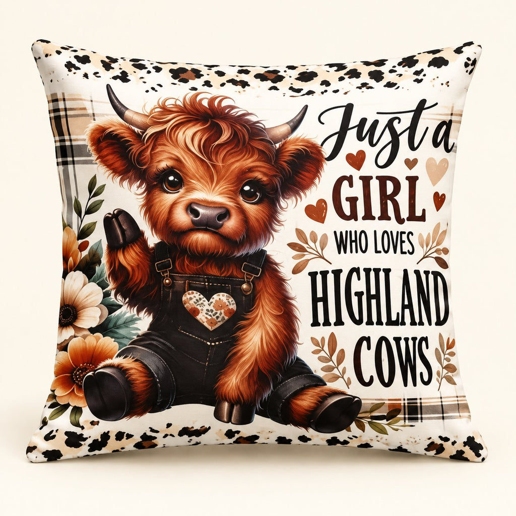 Cream cushion cover printed with a Highland calf in dark dungarees and the wording Just a Girl Who Loves Highland Cows
