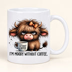 White ceramic Highland cow mug with a grumpy calf, orange checked bow and I’m Moody Without Coffee wording.