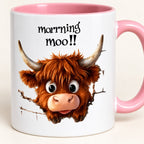 Close-up of the wide-eyed Highland cow and printed Morning Moo design on the pink-handled ceramic mug.