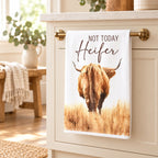 Not Today Heifer Highland cow tea towel displayed on a brass kitchen rail