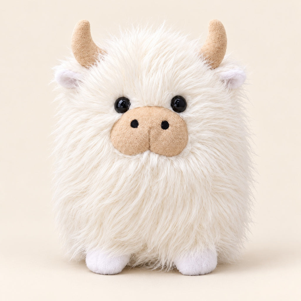 White shaggy Highland cow plush, approximately 22 cm, with cream horns and a beige muzzle on an ivory background. Sold individually.