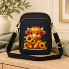 Black mini crossbody bag with a sunflower Highland cow design, styled for everyday outings.