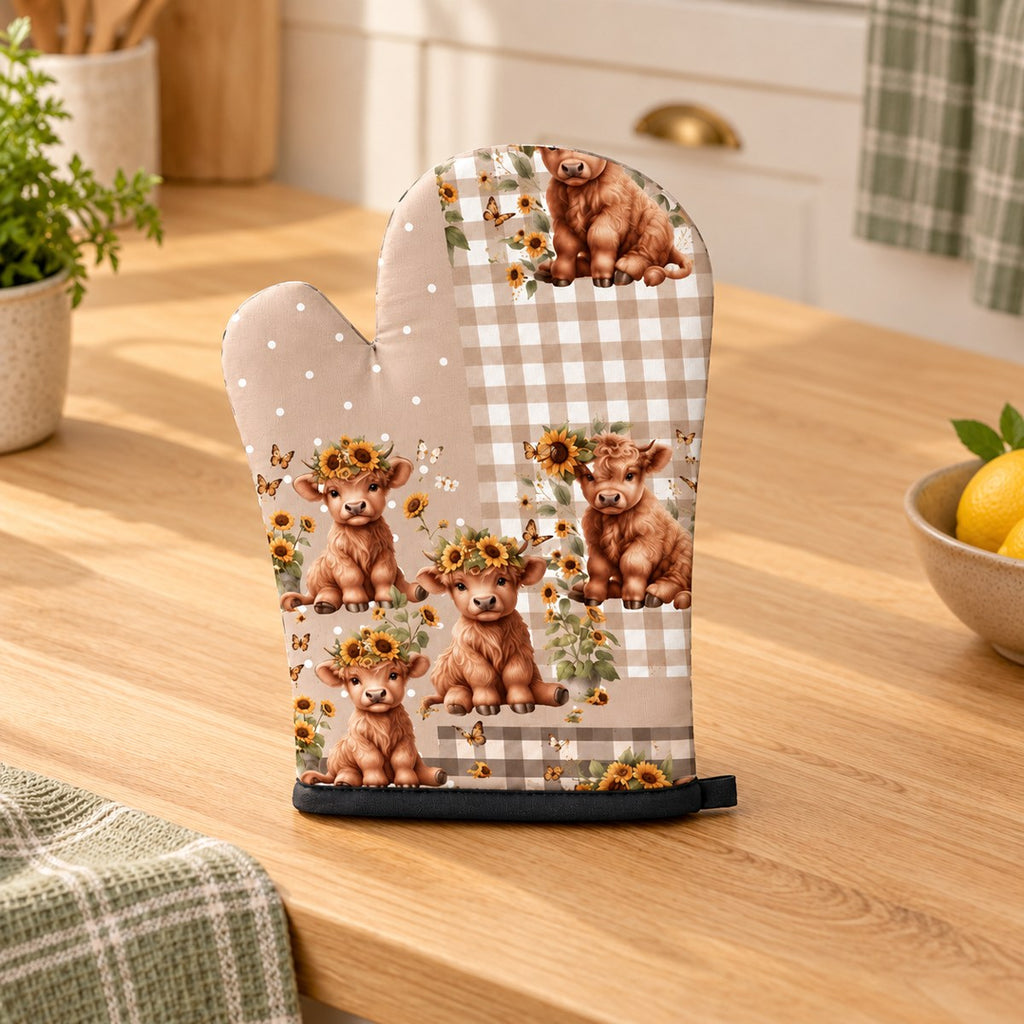 One sunflower patchwork Highland cow oven mitt in a warm country kitchen