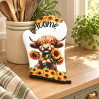 One Welcome sunflower Highland cow oven mitt styled in a warm country kitchen